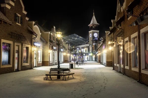 Night landscape of winter street with tower clock