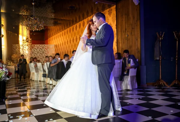 Bride and groom dancing at restaurant banquet hall