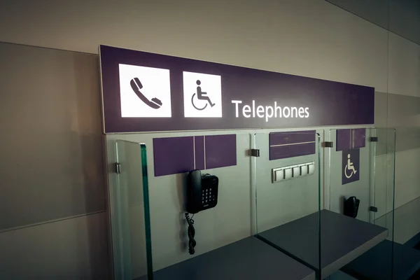 View of telephones in airport terminal