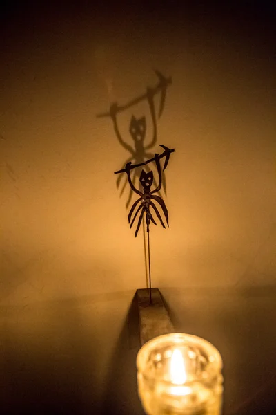 Closeup shot of  scary shadow of demon on wall