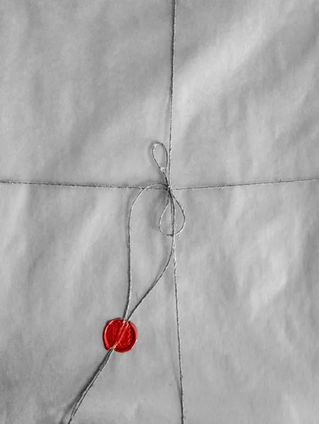 Old envelope packed with twine and red seal wax