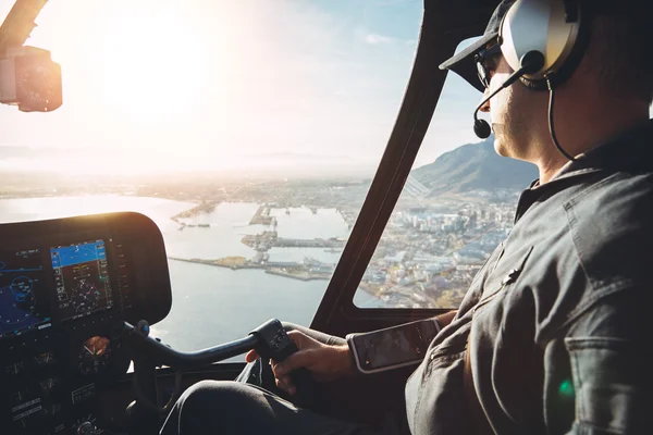 Pilot in cockpit of a helicopter