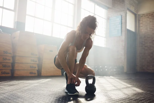 Woman getting ready to workout at the gym