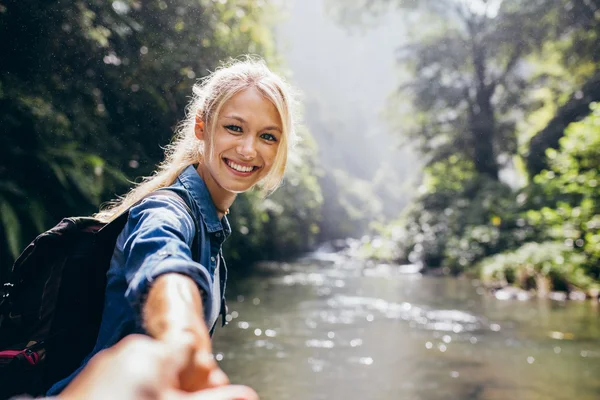 Female hiker holding hand of his boyfriend