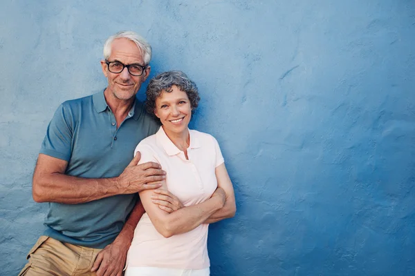 Happy mature couple standing together