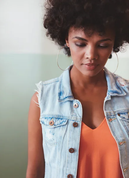 Stylish young woman looking down