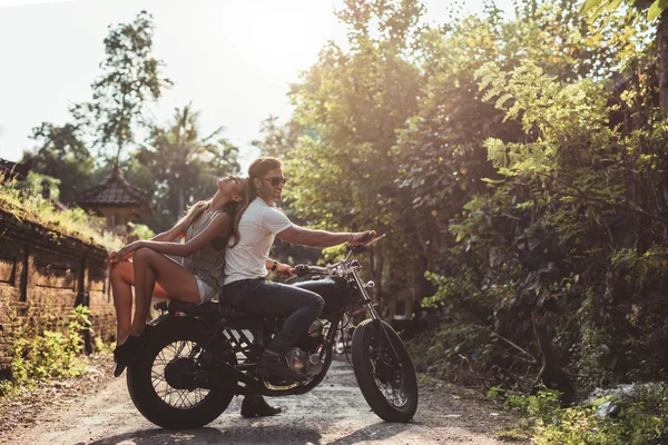 Couple sitting out on motorcycle