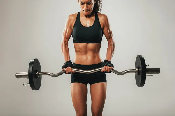 Woman using barbell weight