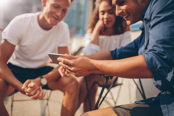 Young people looking at mobile phone