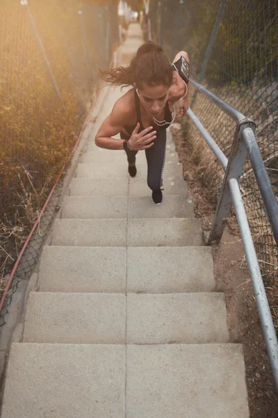 Woman exercising on steps