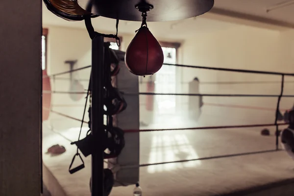 Empty boxing ring with speed bag