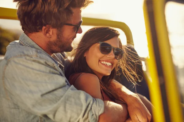 Loving young couple enjoying themselves on a road trip