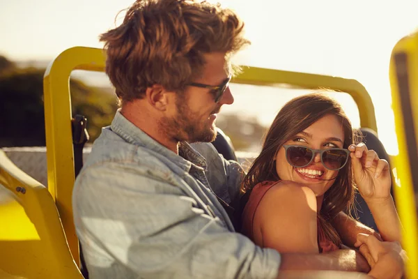 Romantic young couple having fun on a road trip