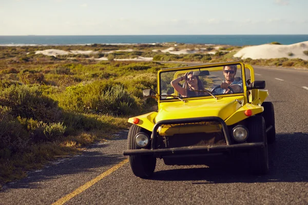 Couple on a road trip in beach buggy