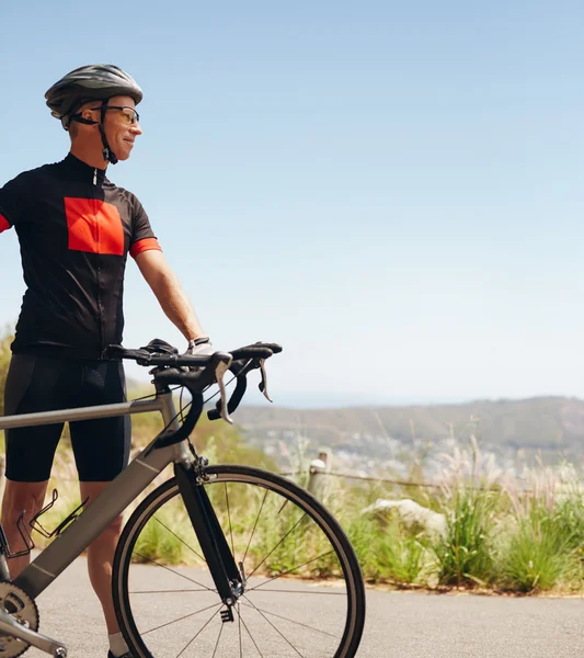 Happy male cyclist on the country side