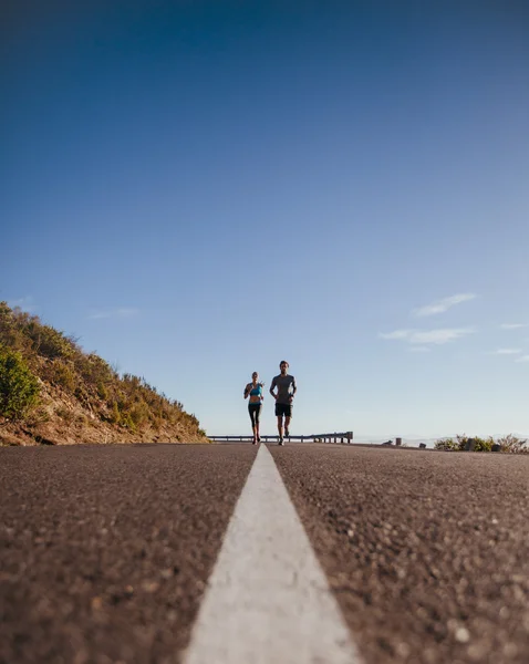 Runners training together on the road