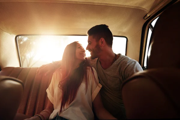 Happy young couple on road trip