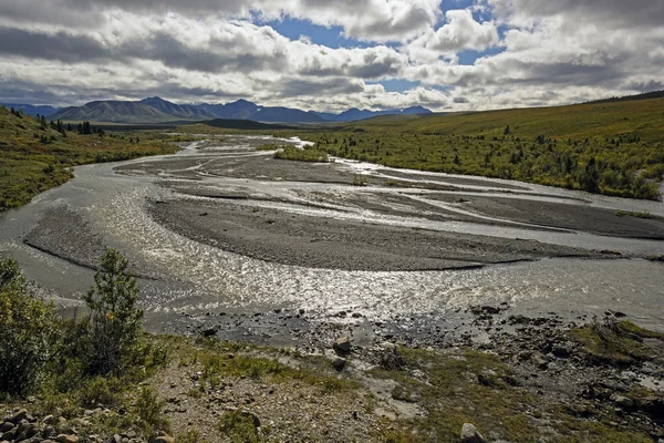 Sun and Clouds on a Braided River