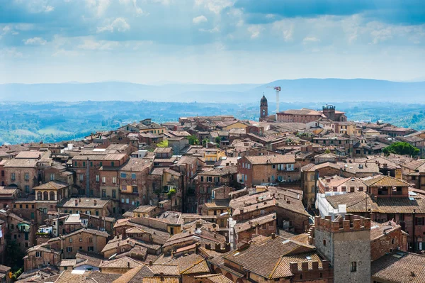 Siena. Image of ancient Italy city, view from the top. Beautiful house and chapel.