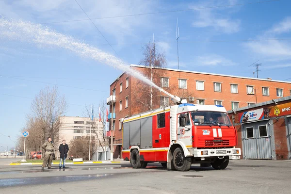 Kamaz truck, Russian fire engine with running hose