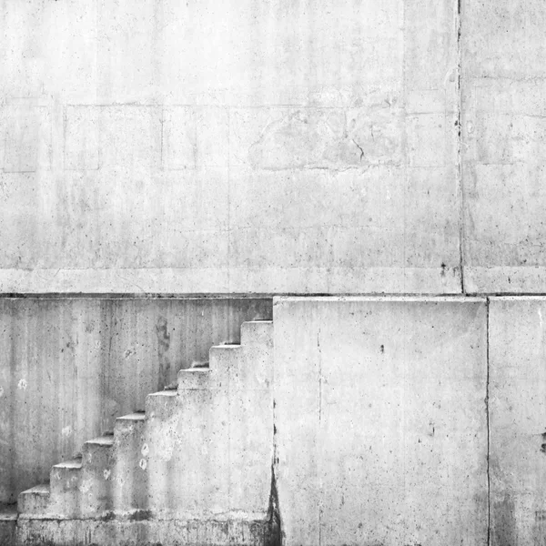 White concrete interior with stairway on the wall