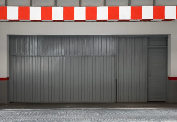 Empty urban interior with parking gate and striped border