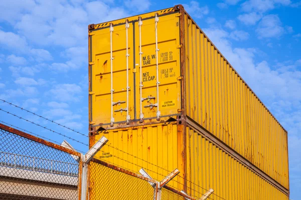Yellow metal Industrial cargo containers are stacked