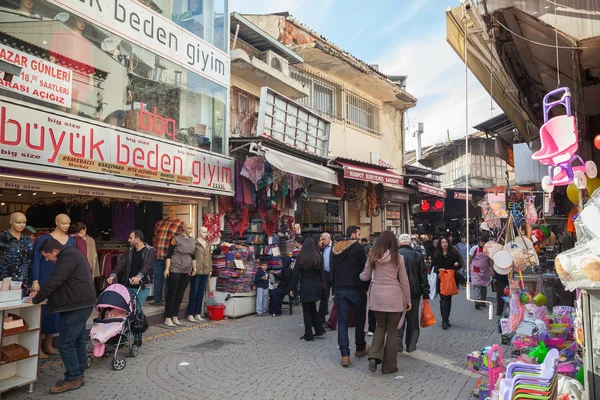 Turkish bazaar street view with sellers and crowd of buyers