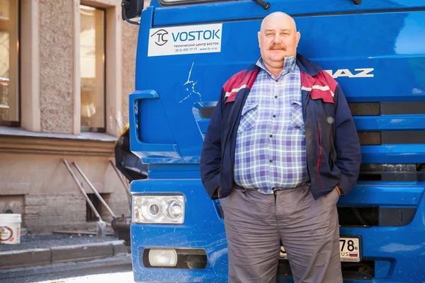 Senior positive truck driver with mustaches