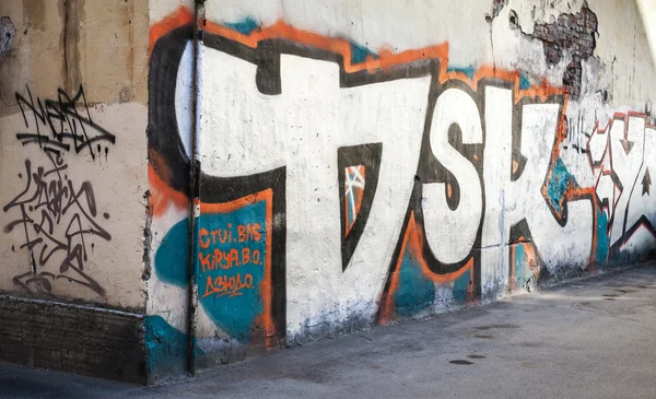 Street art, old urban wall with grungy graffiti