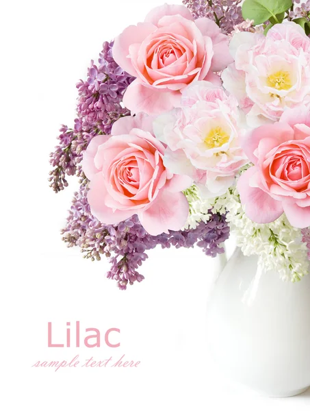 Lilac flowers, roses and tulips bunch in vase isolated on white background