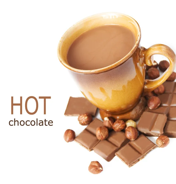 Hot chocolate drink with chocolate bar, cakes and nuts isolated on white background with sample text