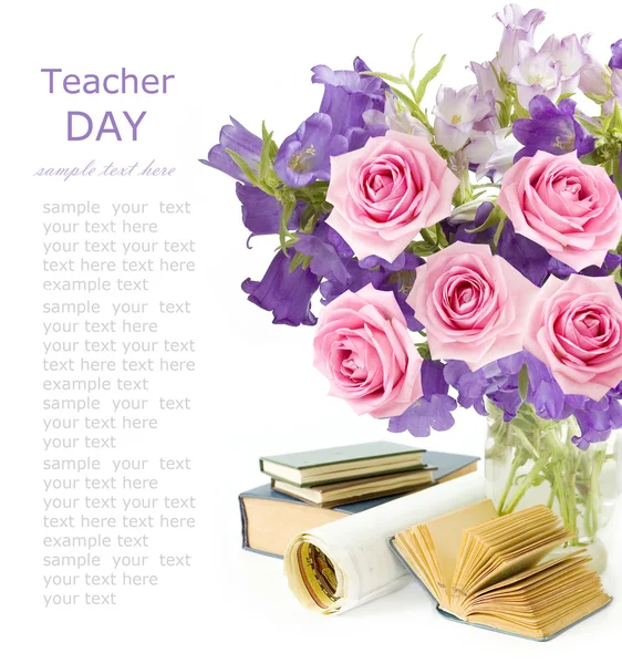 Teacher Day (still life with bunch with bluebells flowers and roses, map and books isolated on white background with sample text)