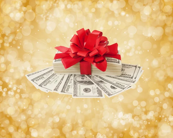 New Year Money gift. New Year Money bonus. Stack with money with red bow on new year background
