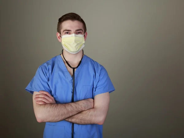 Confident Young Doctor in Scrubs