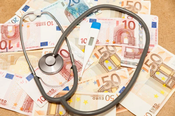 Euro banknotes and one stethoscope