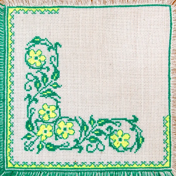 Embroidered good by cross-stitch pattern