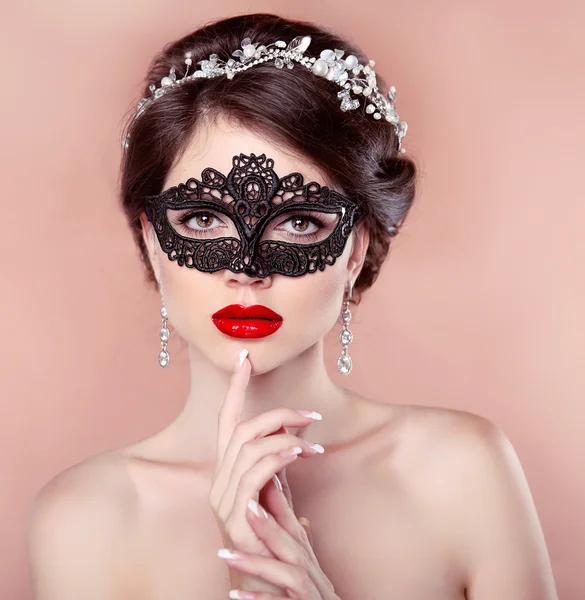 Red lips. Mask. Beautiful girl model with fashion jewelry, manic