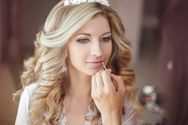 Beautiful bride woman with wedding makeup and hairstyle. Stylist