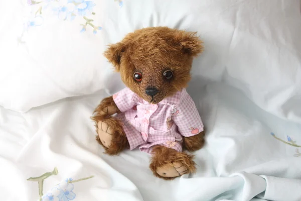 Cute teddy bear in pink pyjama