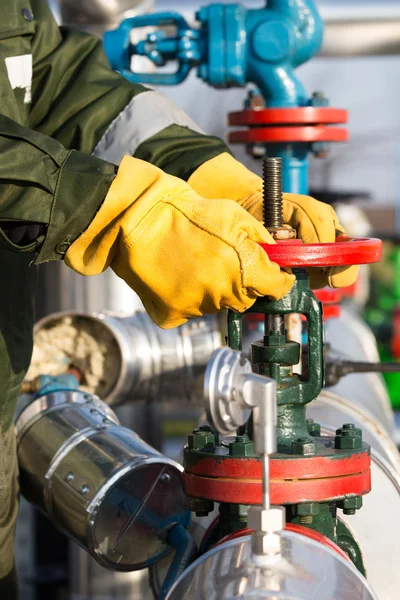 Oil worker turning valve