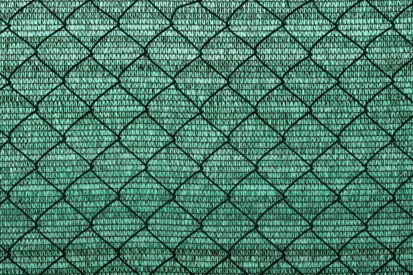 Abstract plastic net texture for green background, with shadow wired fence