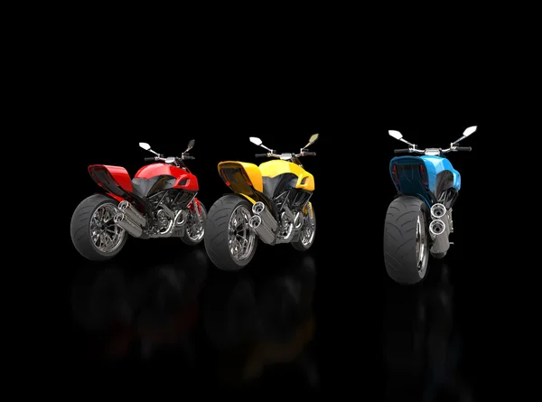 Sports motorcycles - red yellow and blue - back view