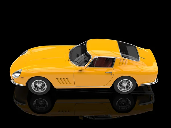 Yellow vintage sports car - top side view