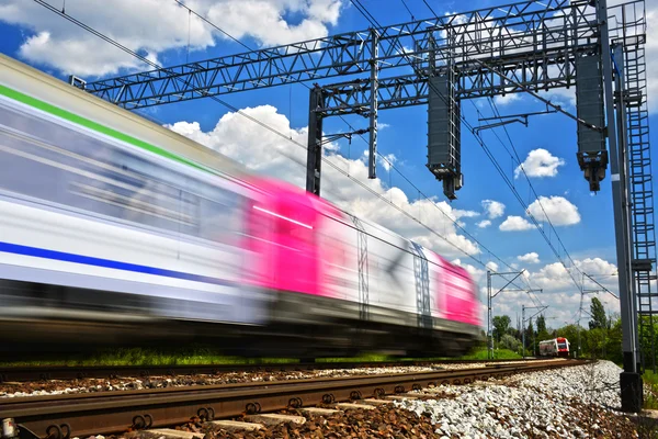 Modern electric passenger train moving on full speed