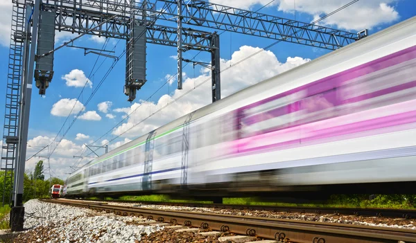 Modern electric passenger train moving on full speed