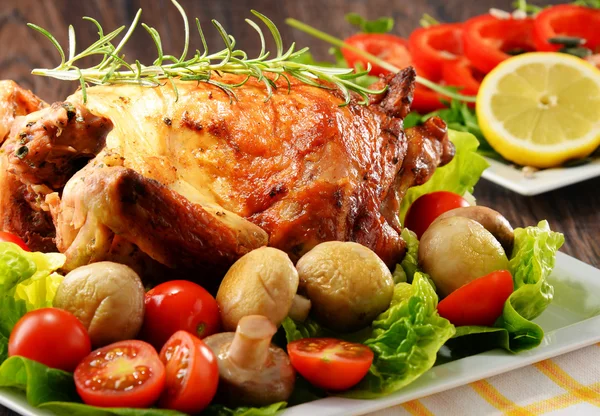 Roasted chicken with tomatoes and mushrooms