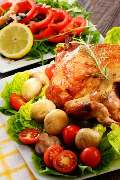 Roasted chicken with tomatoes and mushrooms