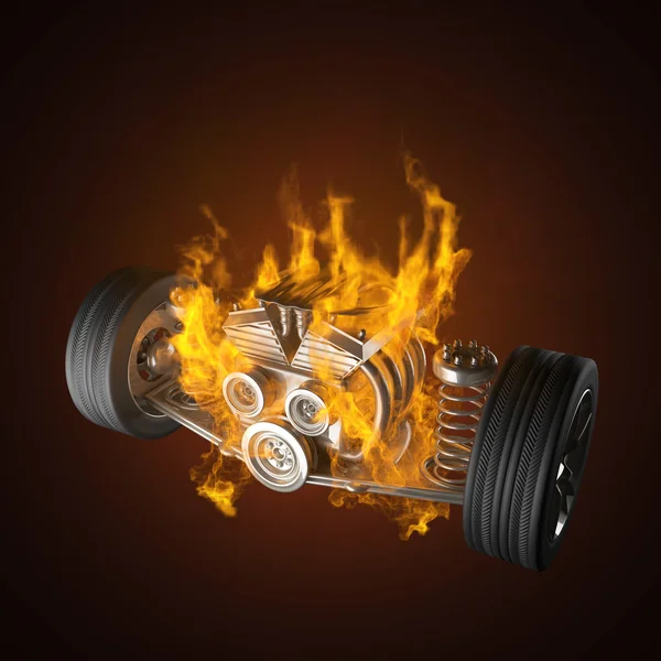 Burning car chassis with engine and wheels