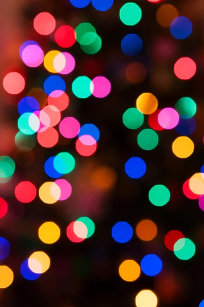 Glowing Christmas lights background in soft focus